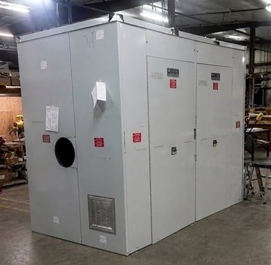 A custom industrial enclosure designed with removable wall panels, custom penetration points, and louver systems for airflow
