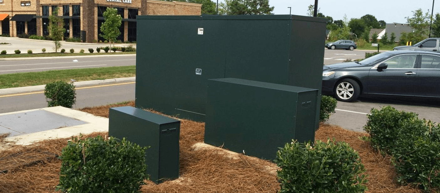 Three Safe-T-Cover aluminum enclosures in Hartford Green finish to blend in with the environment