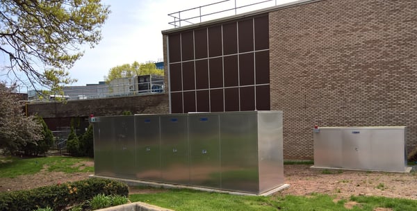 Two Safe-T-Cover custom enclosures installed on site outside a commercial building