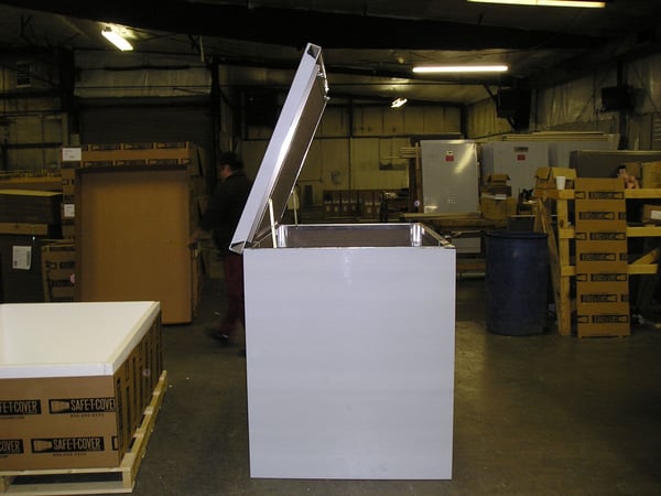 A hinged panel on the roof of a Safe-T-Cover aluminum enclosure