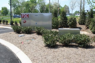 Aesthetically pleasing aluminum enclosure with fire department connection and clear identifying signage