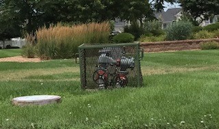 backflow cage for irrigation system at a park in colorado.jpg