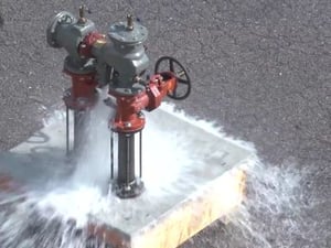 A failing rpz backflow preventer gushing with water flow
